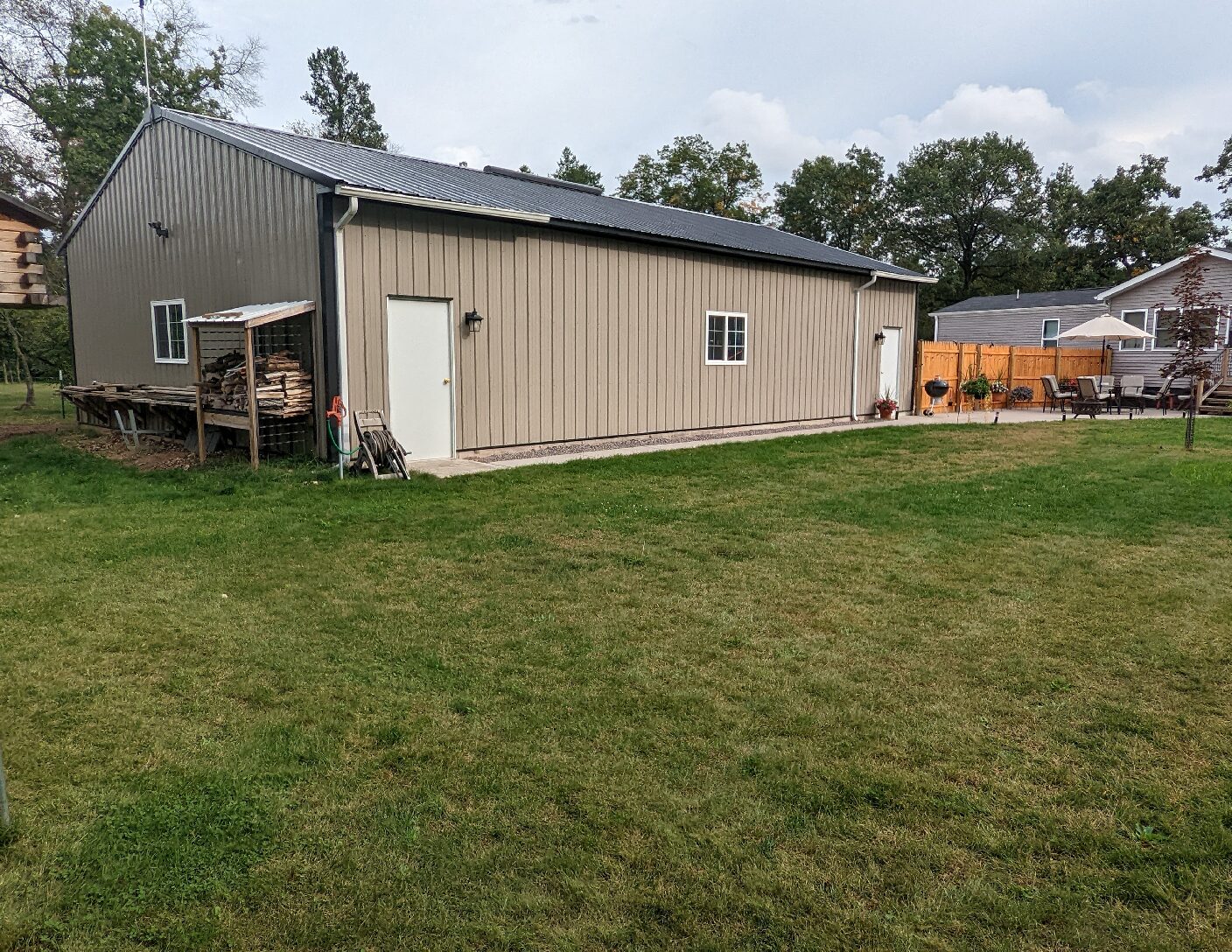 backyard with barn and wood holder attachment